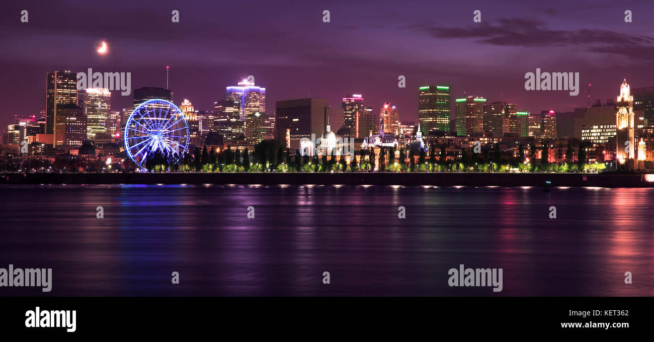 Montreal skyline and St Lawrence River illuminated at night, Quebec, Canada Stock Photo