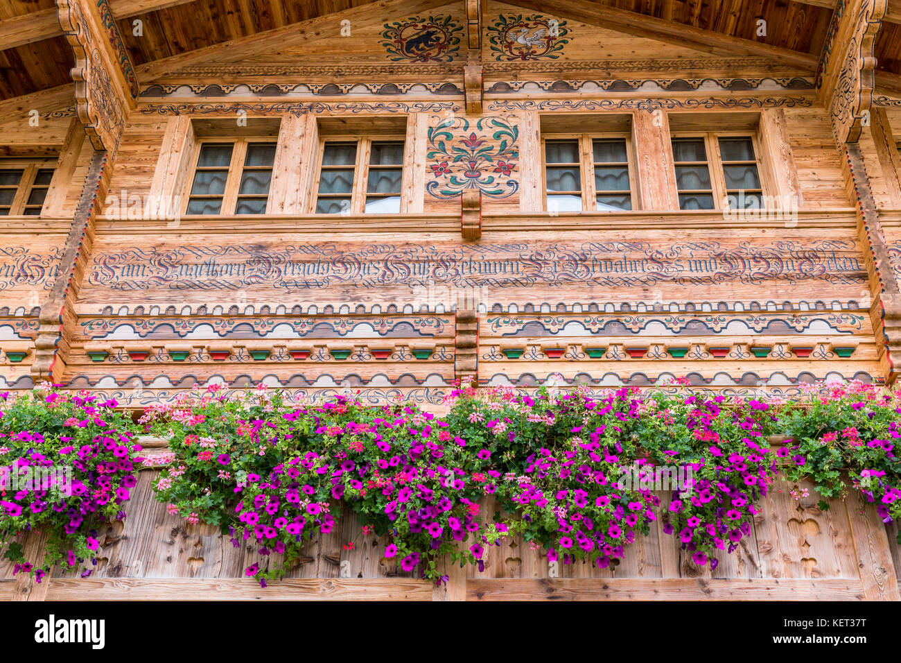 Typical old wooden house in Gstaad, Canton of Bern, Switzerland Stock Photo