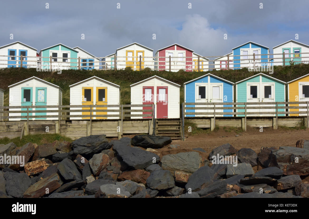 Colourful beach huts and chalets on the beach at the seaside at Bude in