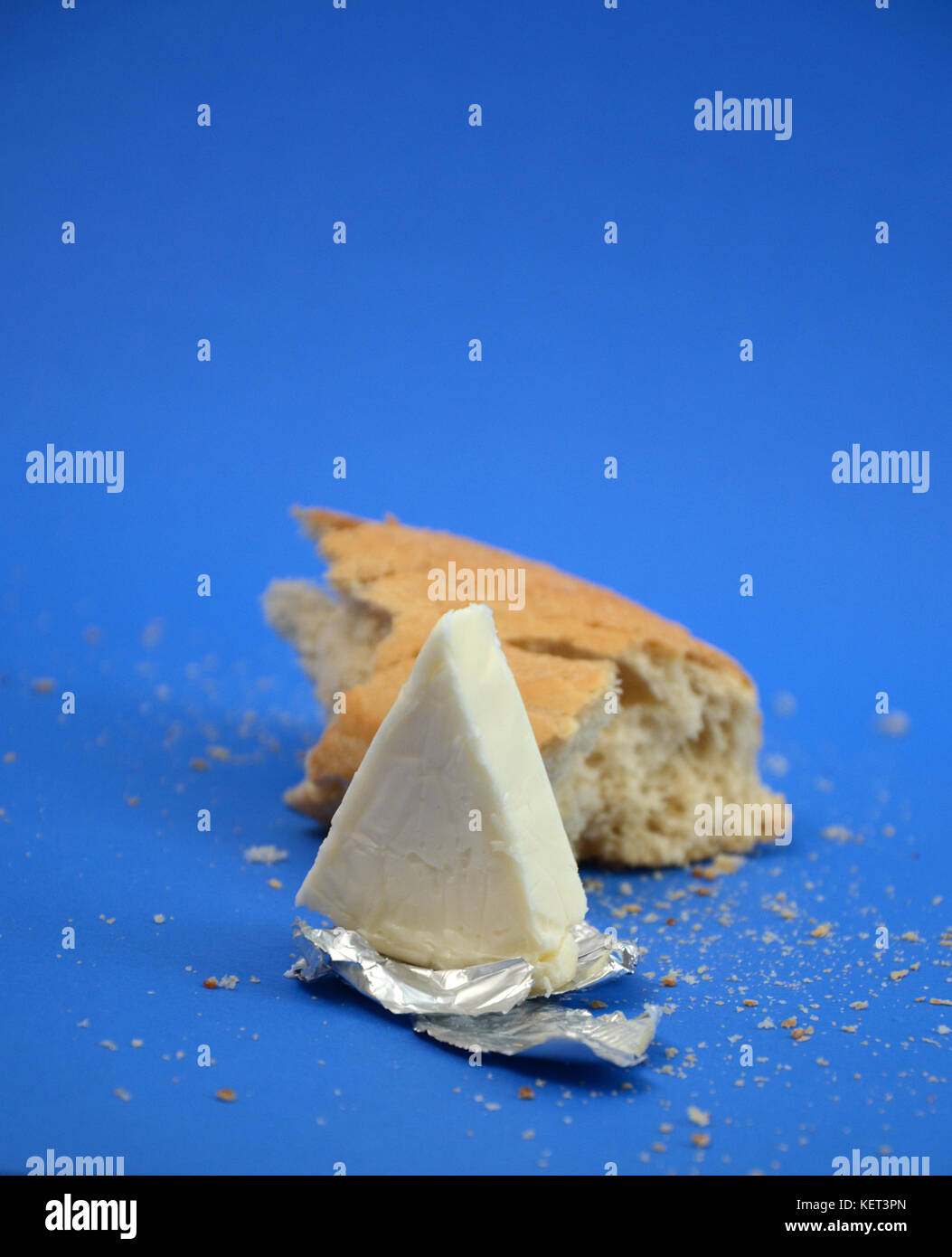 picture of a processed cheese on a blue background Stock Photo Alamy