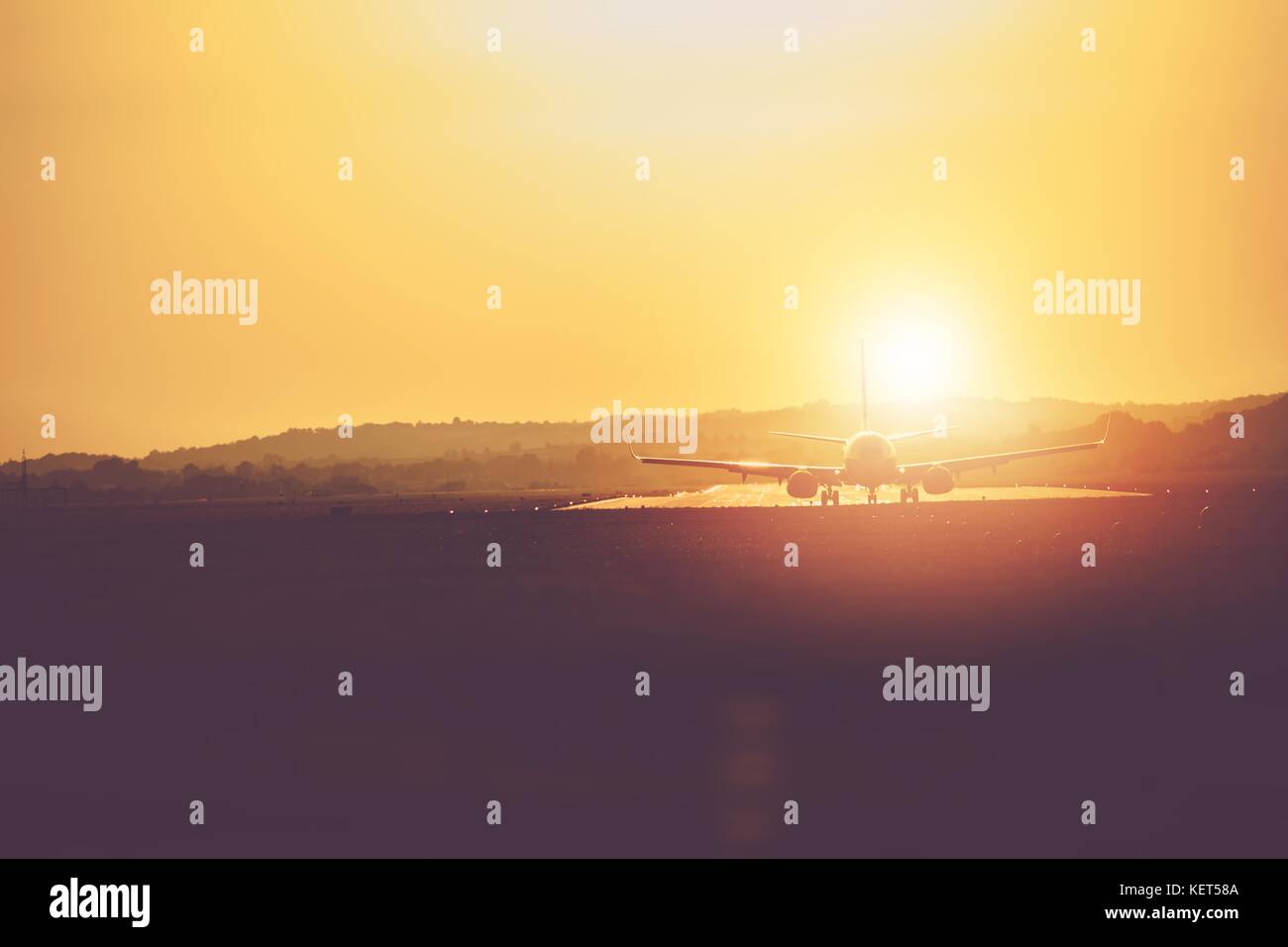 Airplane in the Airport Taking Off From the Runway During Scenic Sunset ...