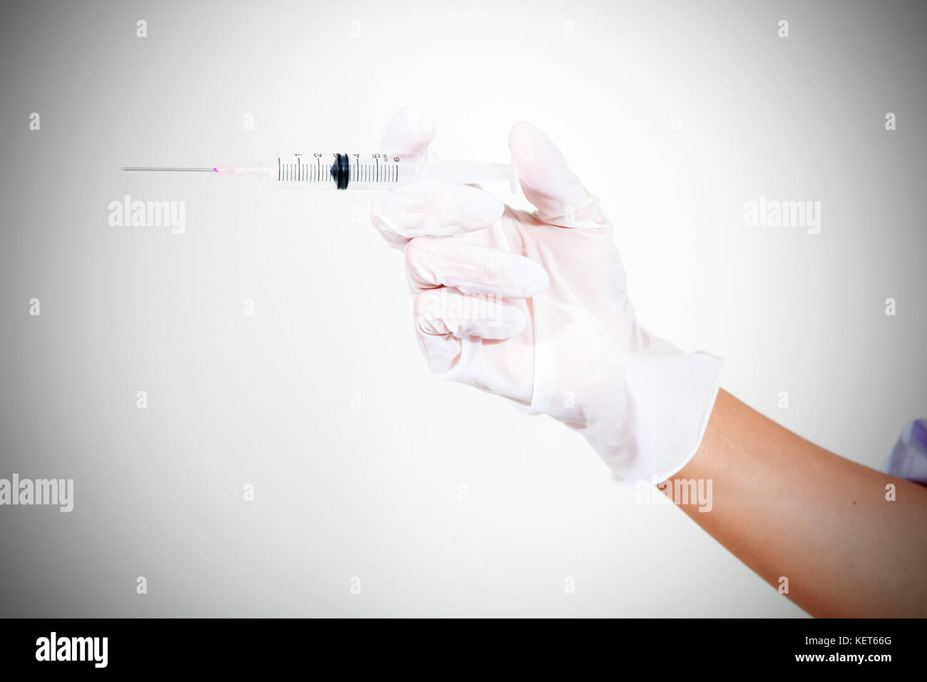 Doctor holding medical injection syringe and Medicine plastic ...