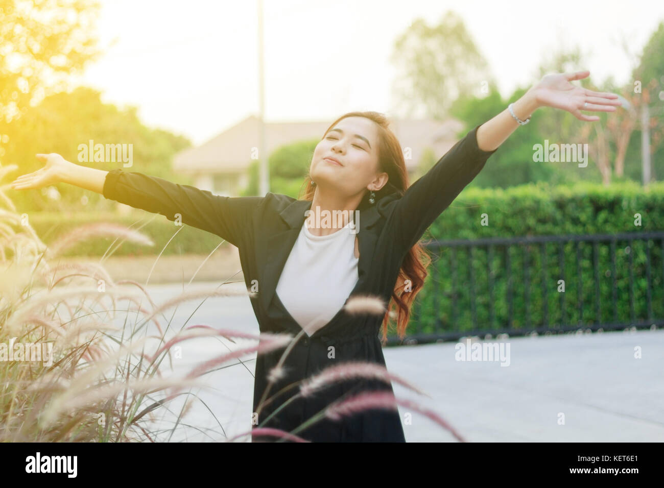 Happy winning success woman sunset hi-res stock photography and images ...