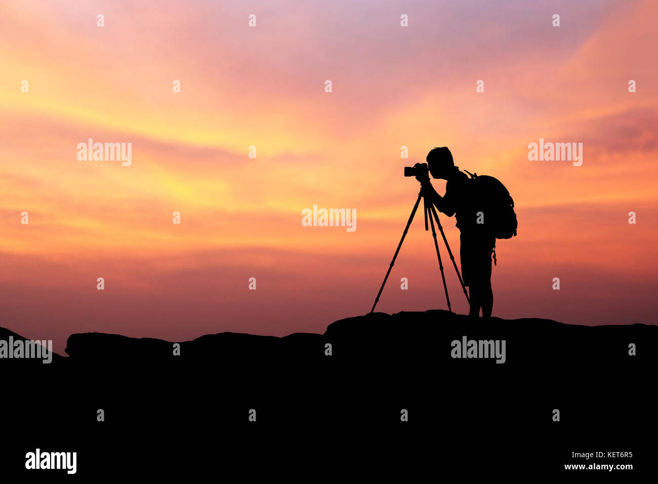 silhouette of man photography and selfie with mountain at sunset .,soft ...