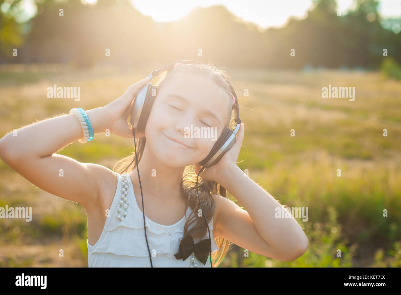 Funny girl listening music with headphones Stock Photo