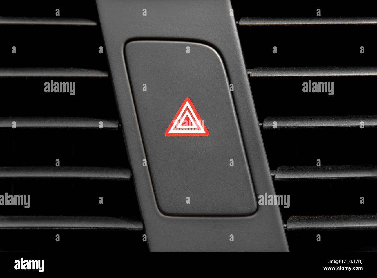 Four blinking light indicator button inside modern luxury car Stock