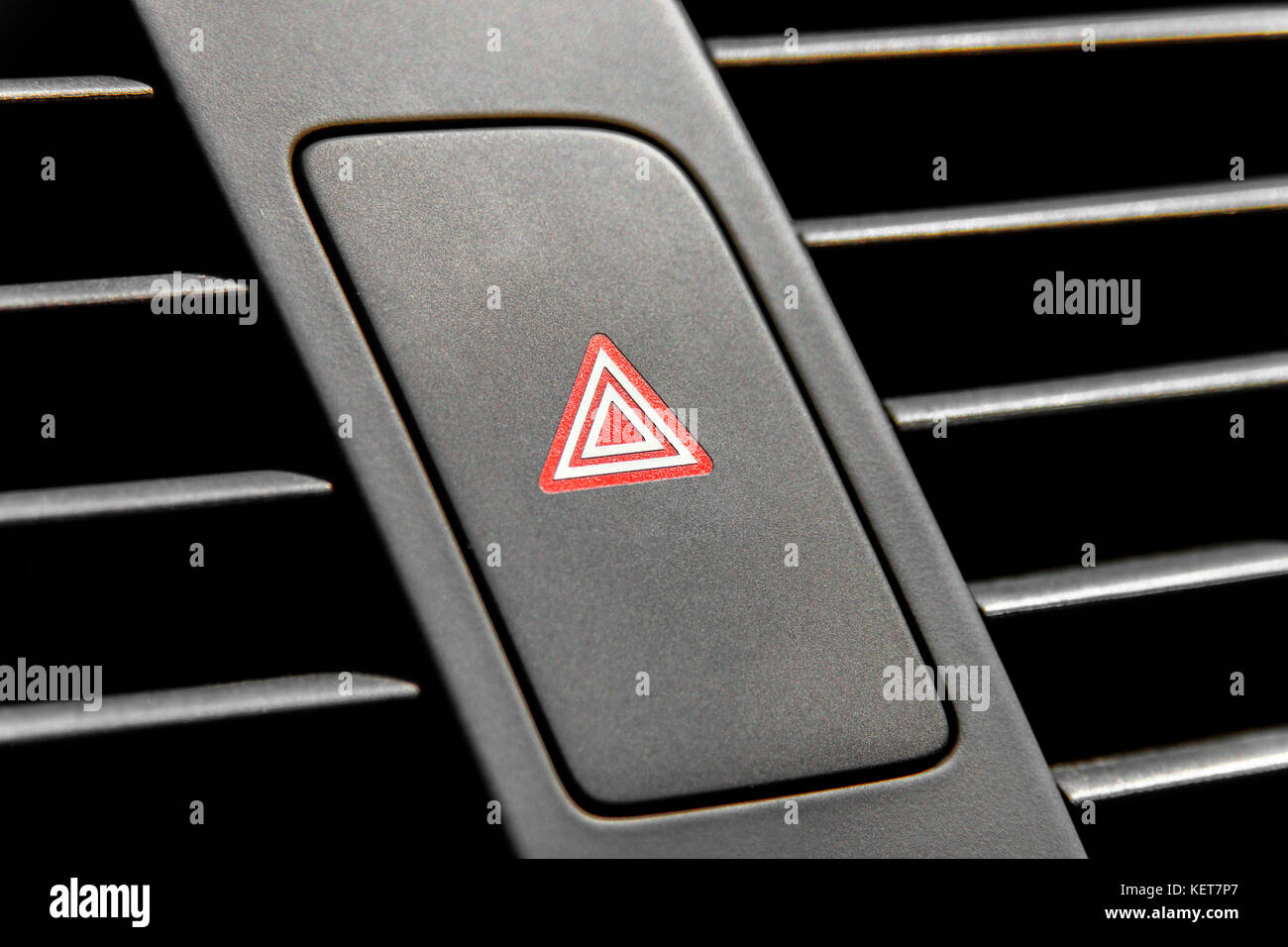 Four blinking light indicator button inside modern luxury car Stock
