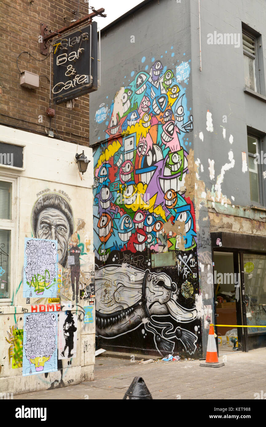 Walls Covered In Street Art And Posters On Brick Lane In London Stock Photo Alamy