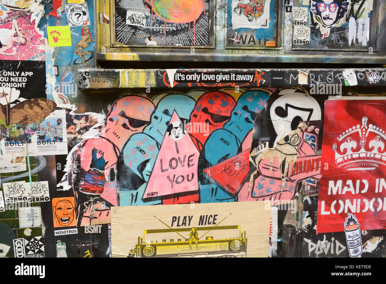 Layers of street art posters and stickers on Brick Lane in London ...