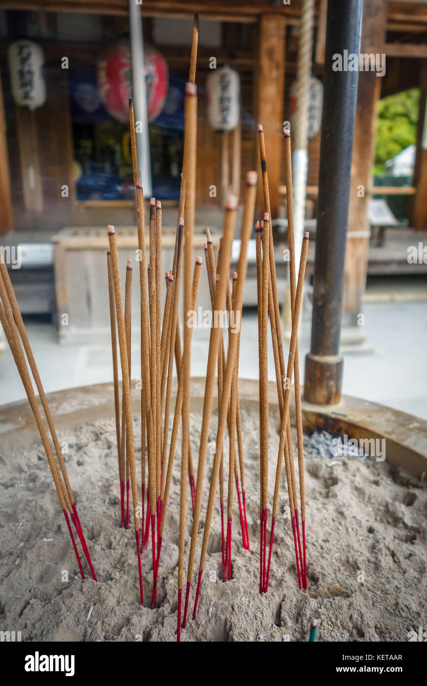 incense sticks in Kinkakuji golden temple, Kyoto, Japan Stock Photo