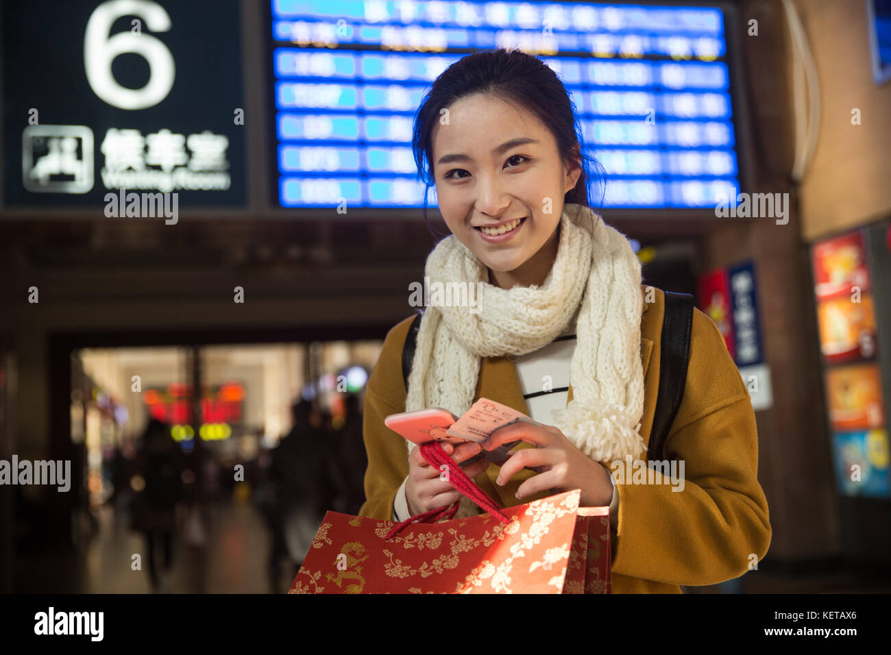 Young women at the railway station Stock Photo - Alamy