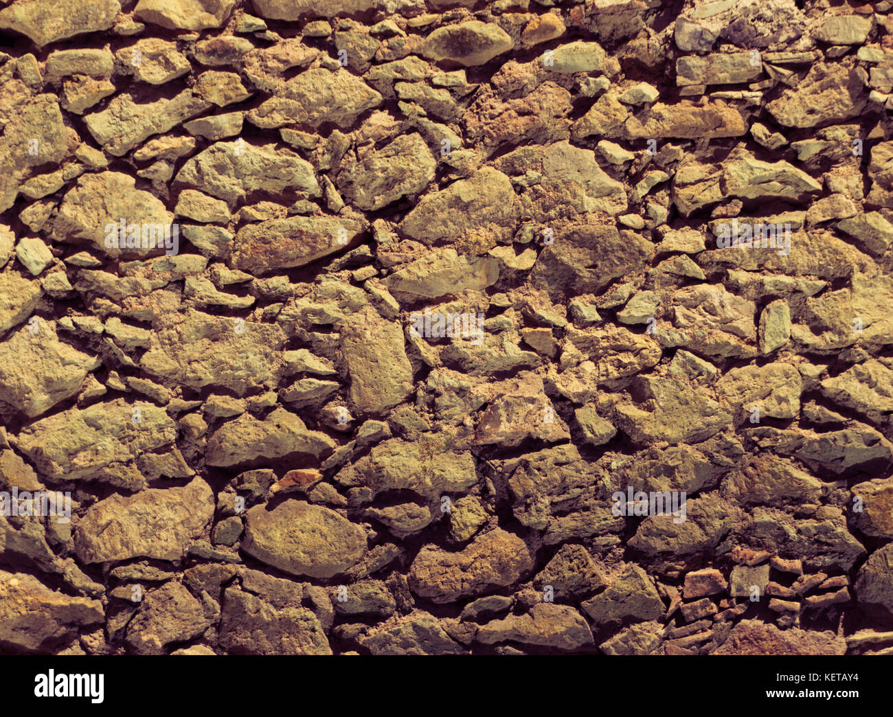 Photograph of a stone wall texture or background Stock Photo - Alamy