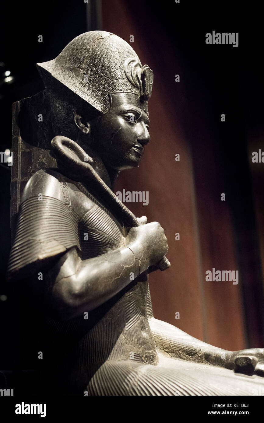 Turin. Italy. Portrait statue of Egyptian Pharaoh Ramesses II wearing a Khepresh crown & holding the Heqa sceptre. Museo Egizio (Egyptian Museum) Stock Photo