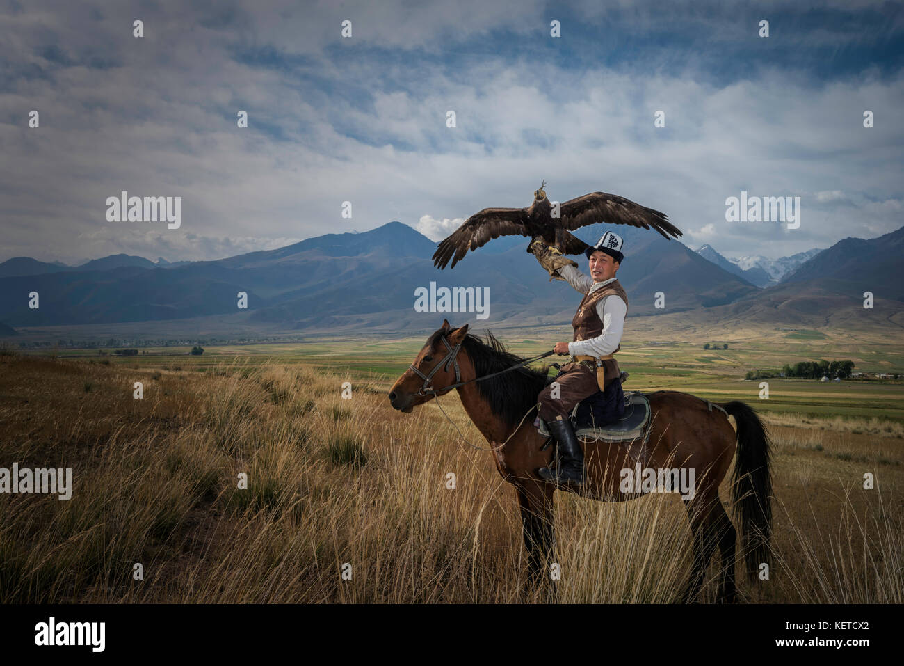 Eagle Hunter riding Horse Stock Photo