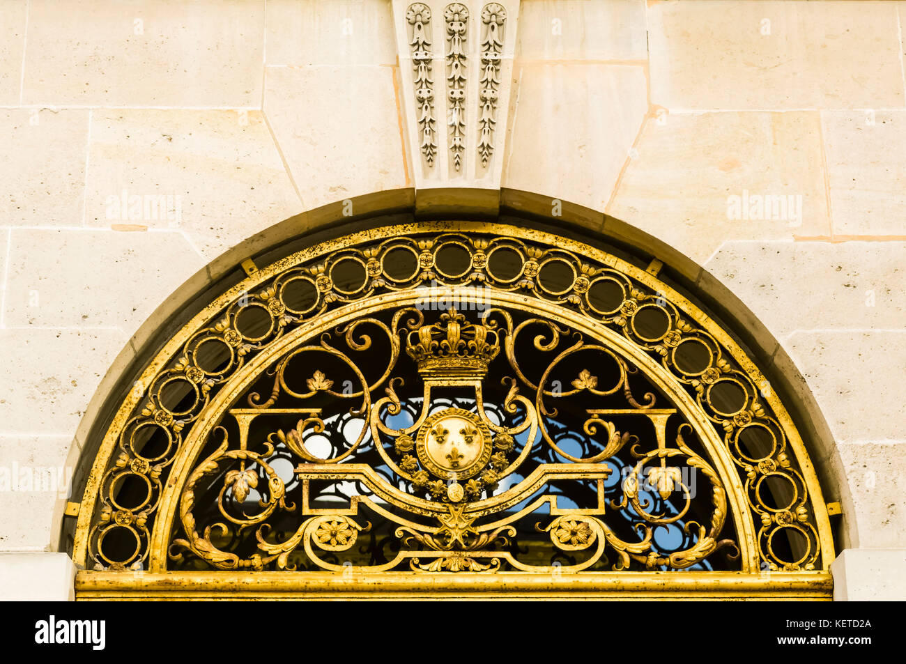 Gold, ornate, window grill at Chateau de Versailles. Copy space