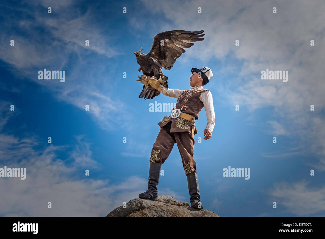 Eagle Hunter on rock Stock Photo