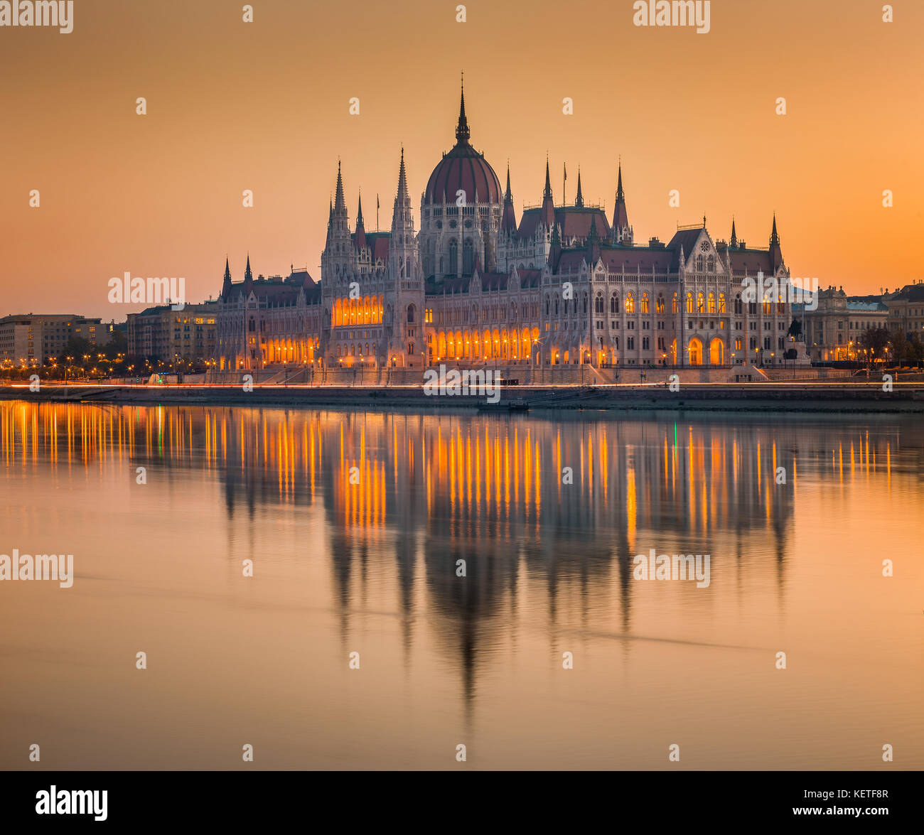 Budapes, Hungary - Beautiful orange sunrise at the Hungarian Parliament with reflection on the River Danube Stock Photo