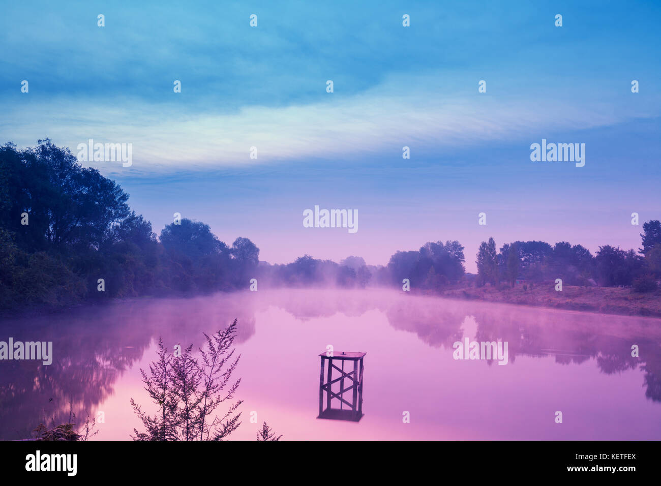 Early in the morning, dawn over the lake. Calm lake before sunrise. A ...