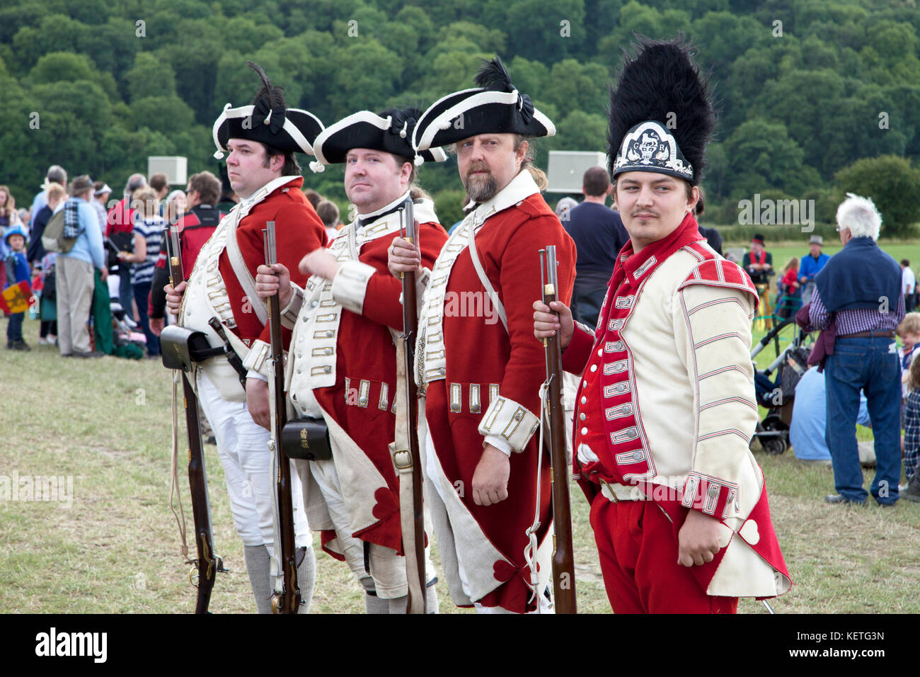 Men in infantry uniforms taking part in a re-enactment at a history festival. Stock Photo