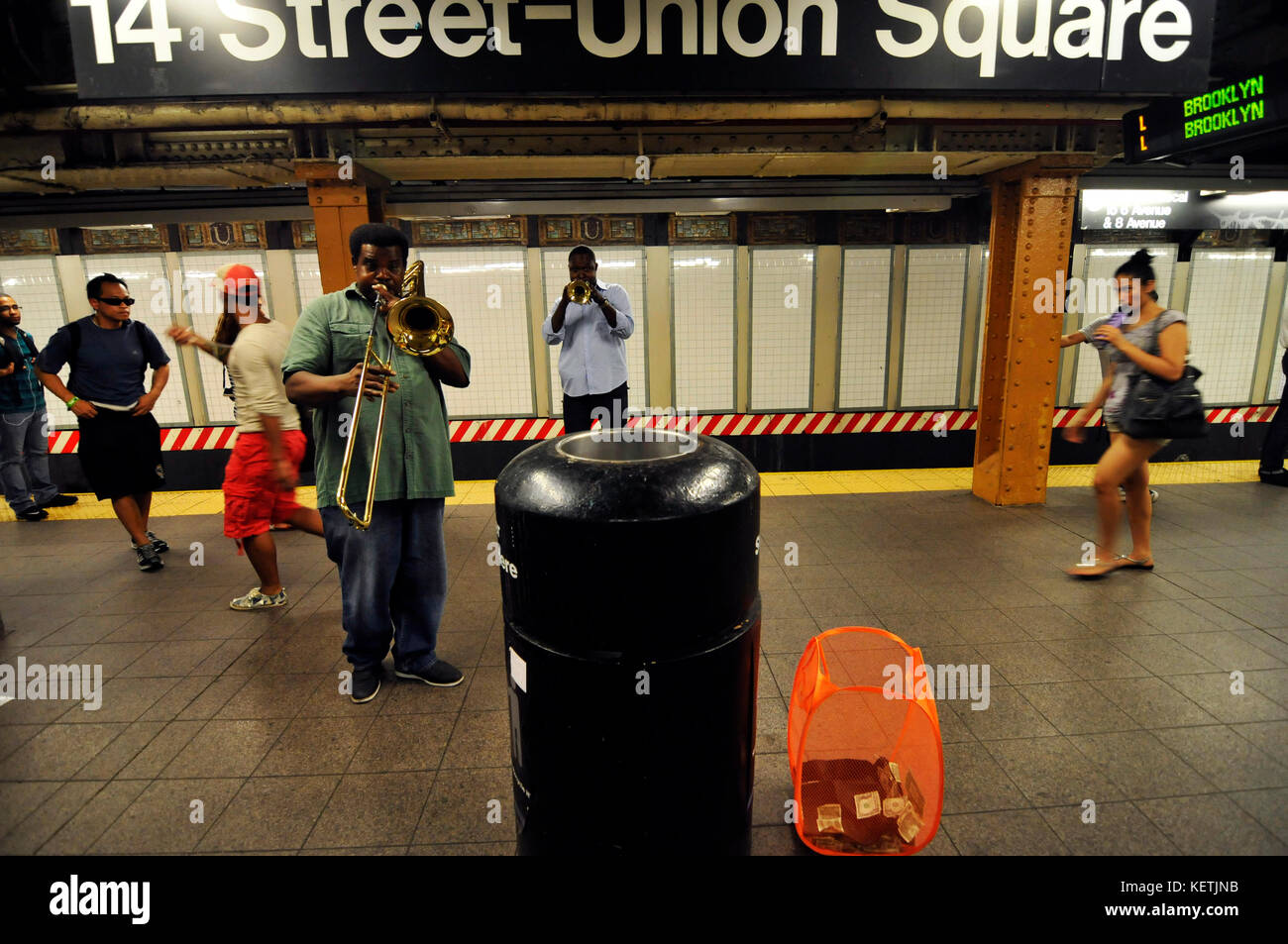 Musicians playing on the platform of Union Square subway station. Stock Photo