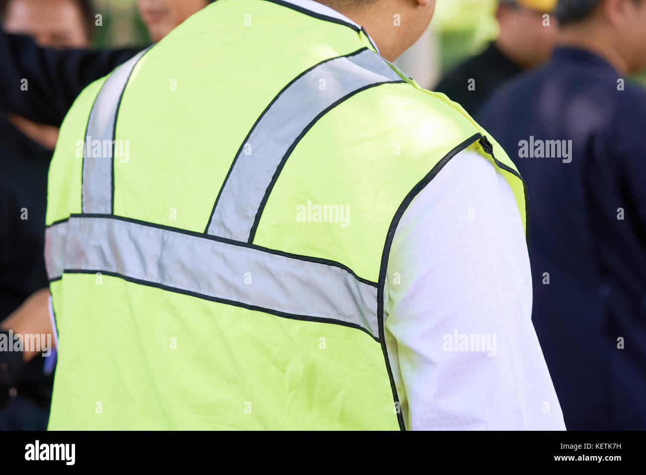 Foreman oversee construction work, wear reflective workwear for work safety. The reflector has a silver reflective reflector and a green reflective ki Stock Photo