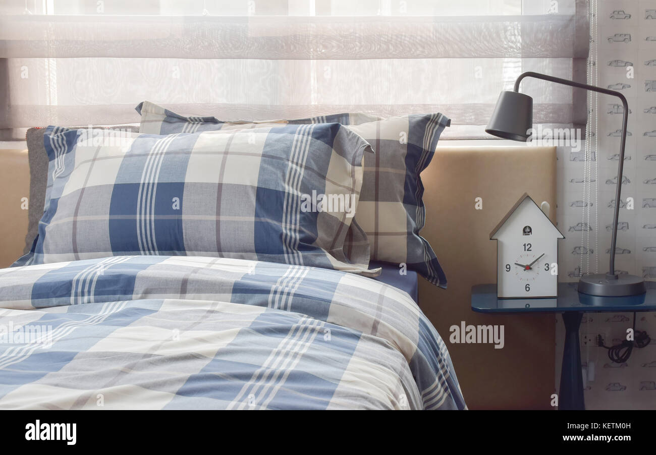 Cozy Bedroom Interior With Pillows And Reading Lamp On