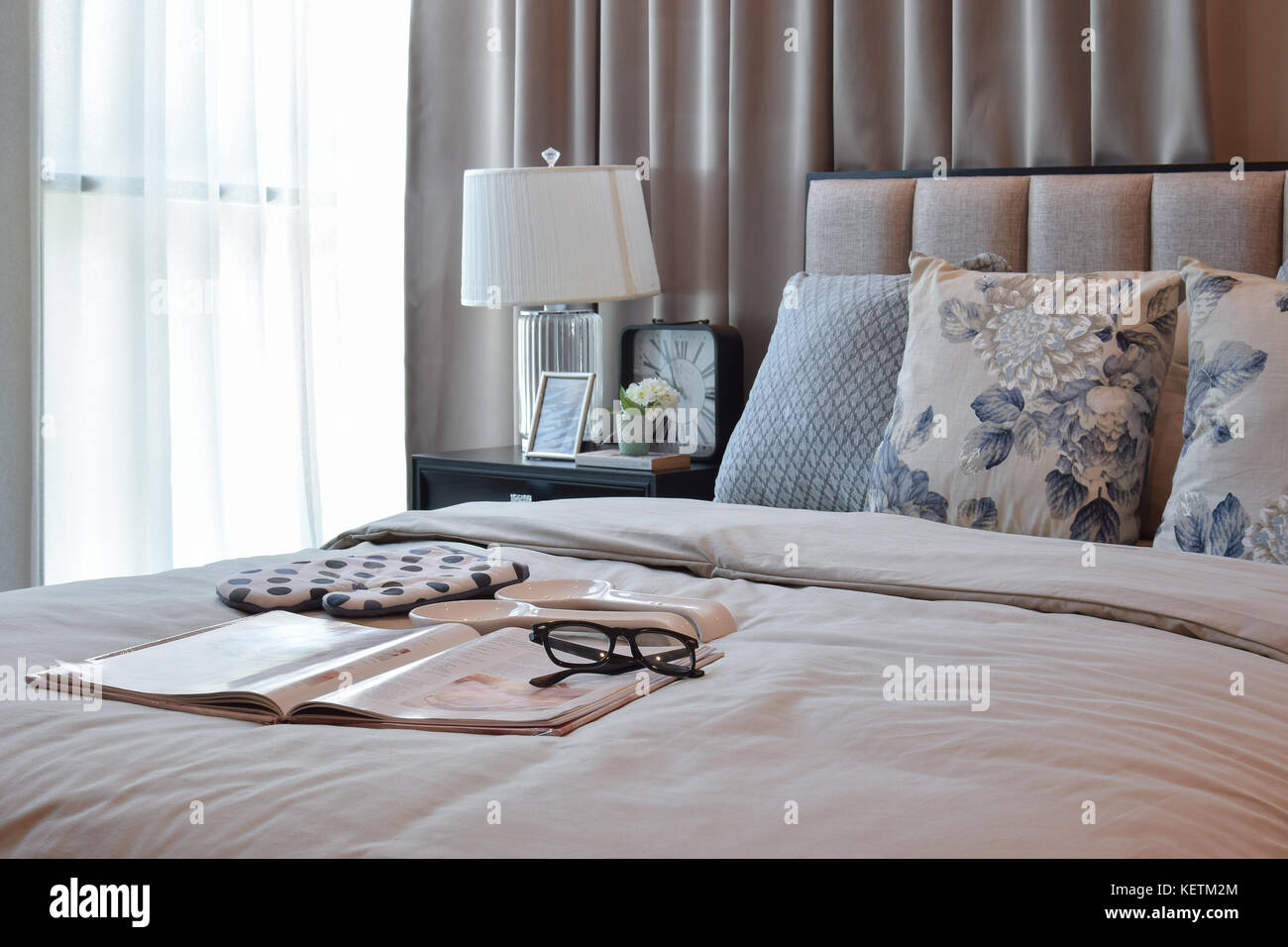 elegant bedroom interior design with floral pattern pillows on bed and ...