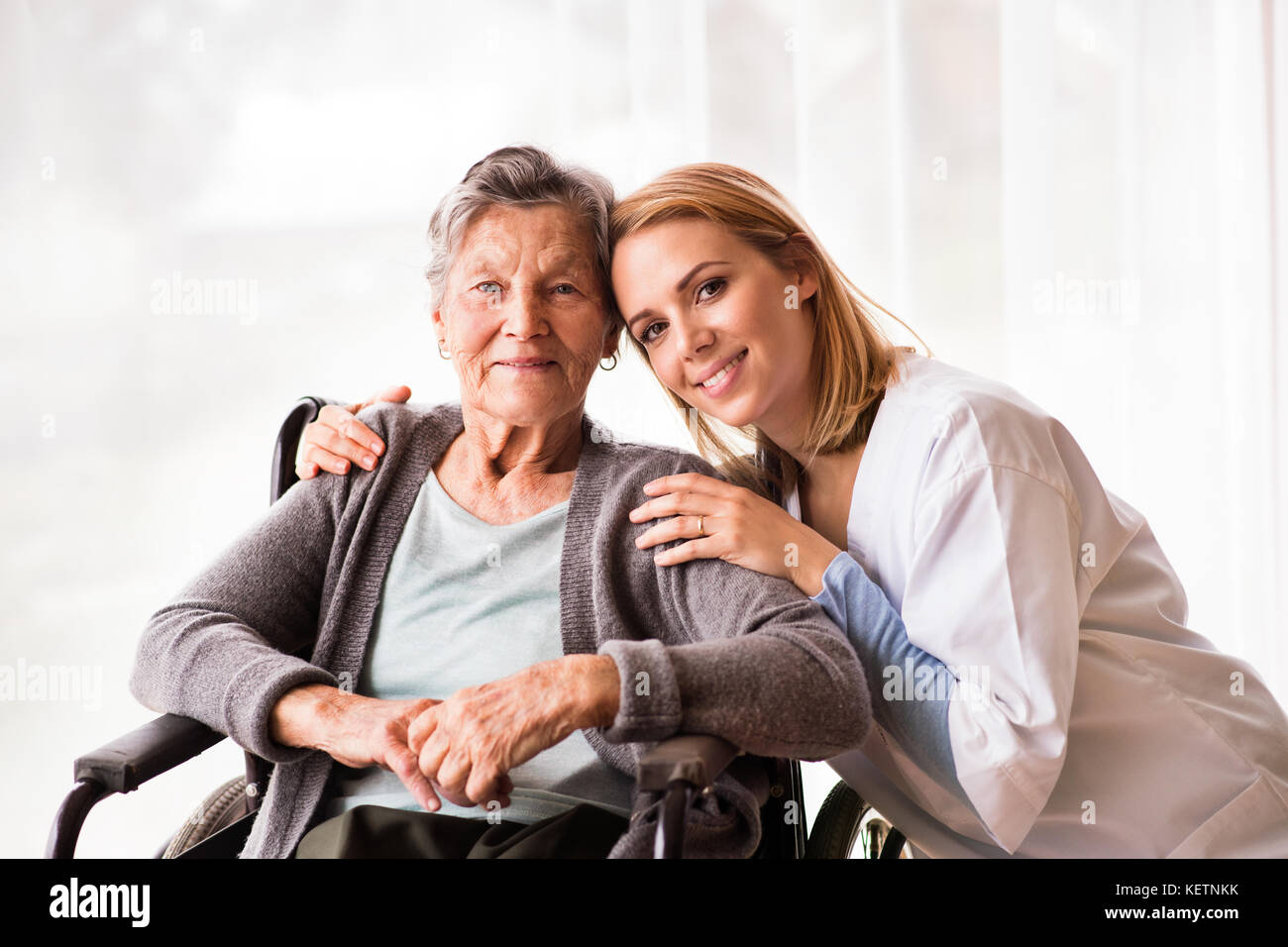 Health visitor and a senior woman during home visit Stock Photo Alamy