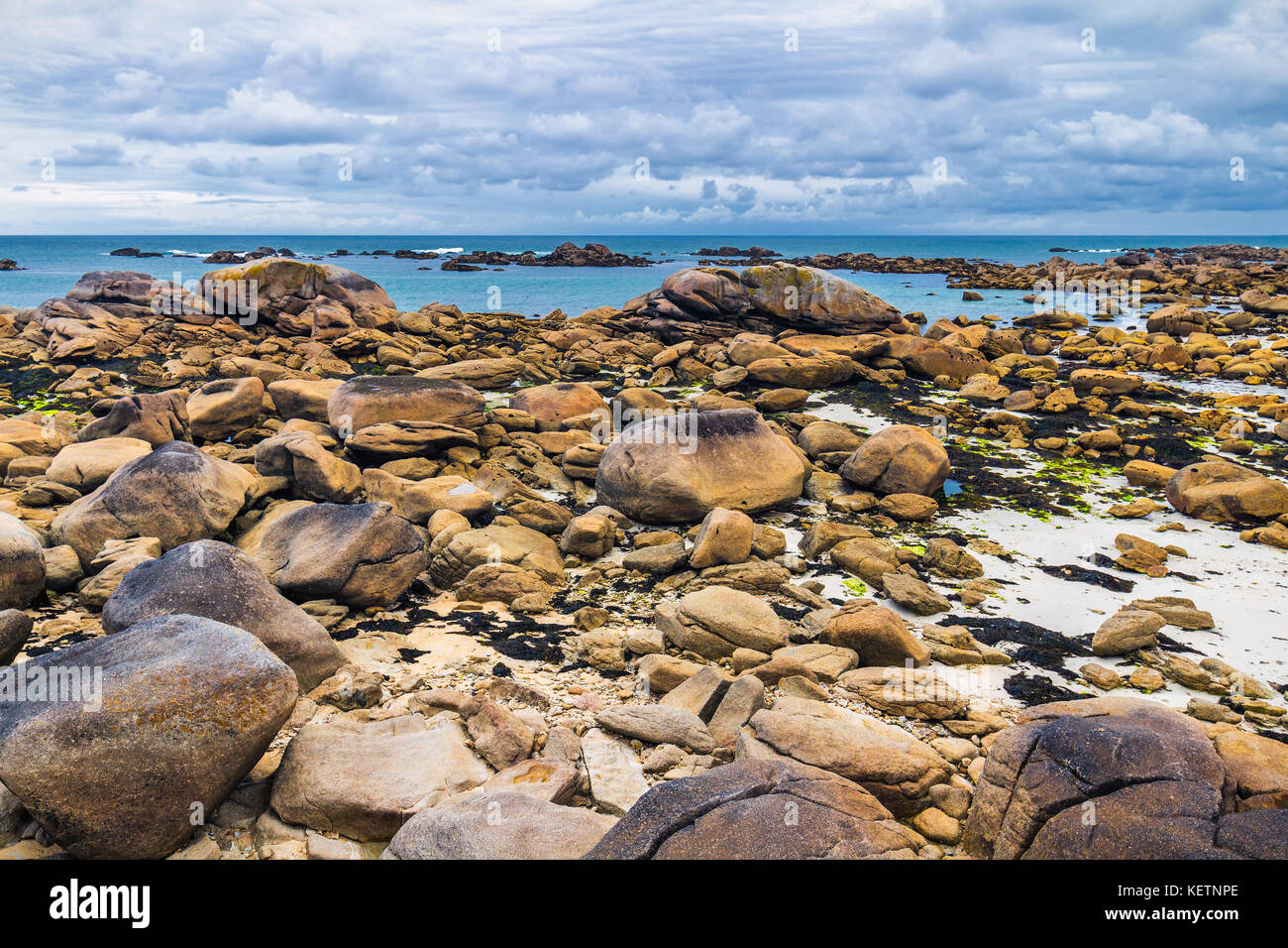 Pink Rocks France The pink granite rocks with strange shapes, coast in Brittany. The mass ...