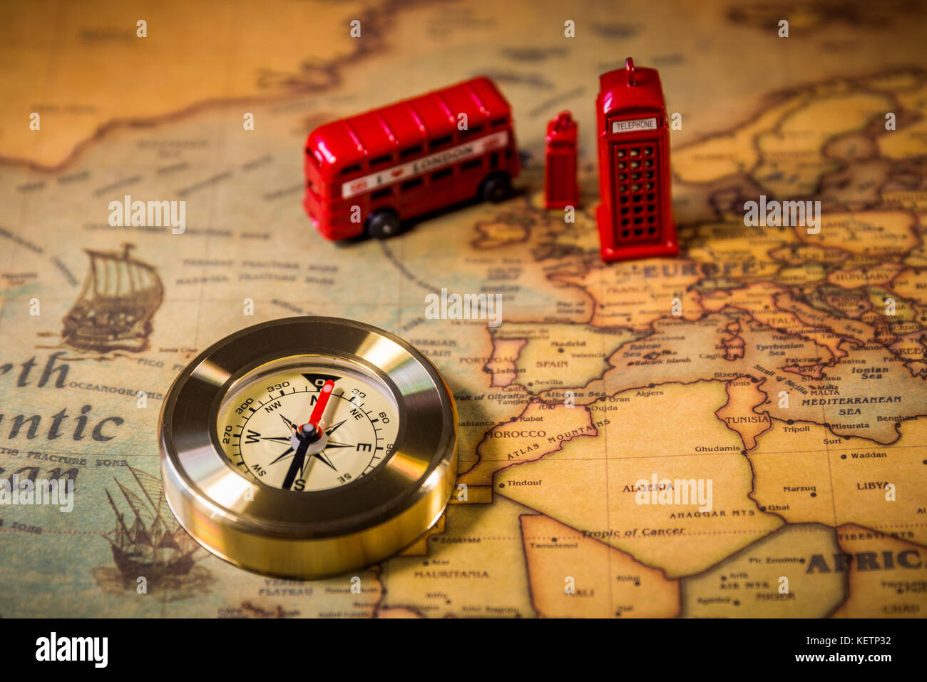 London map with Big Ben, double decker bus in miniature and compass, travel concept. England, UK. Stock Photo