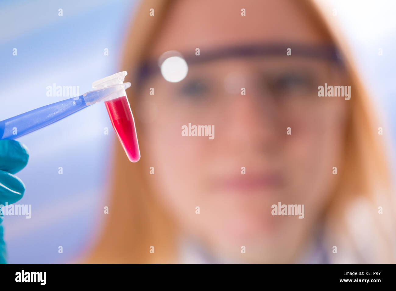 Female laboratory assistant with blood test for AIDS Stock Photo Alamy