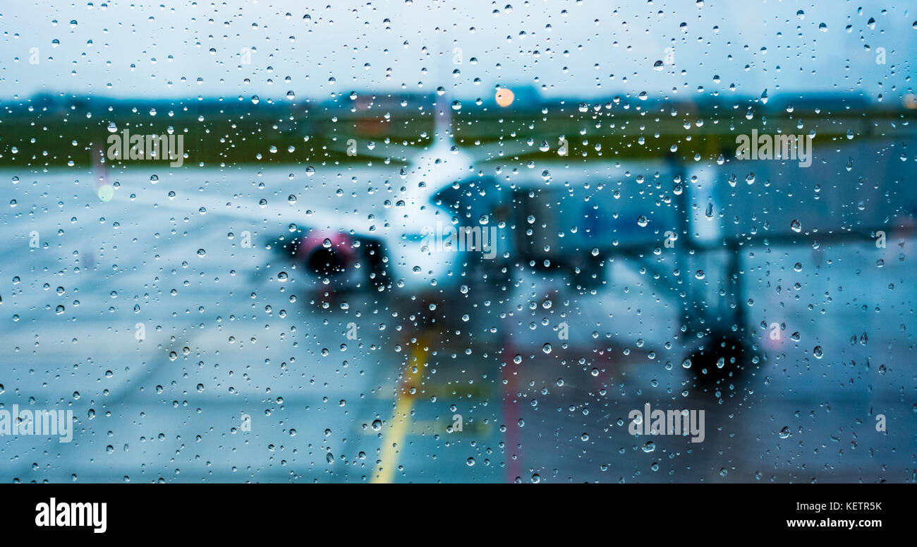 View from the airplane window in rainy nonflying weather rain Stock