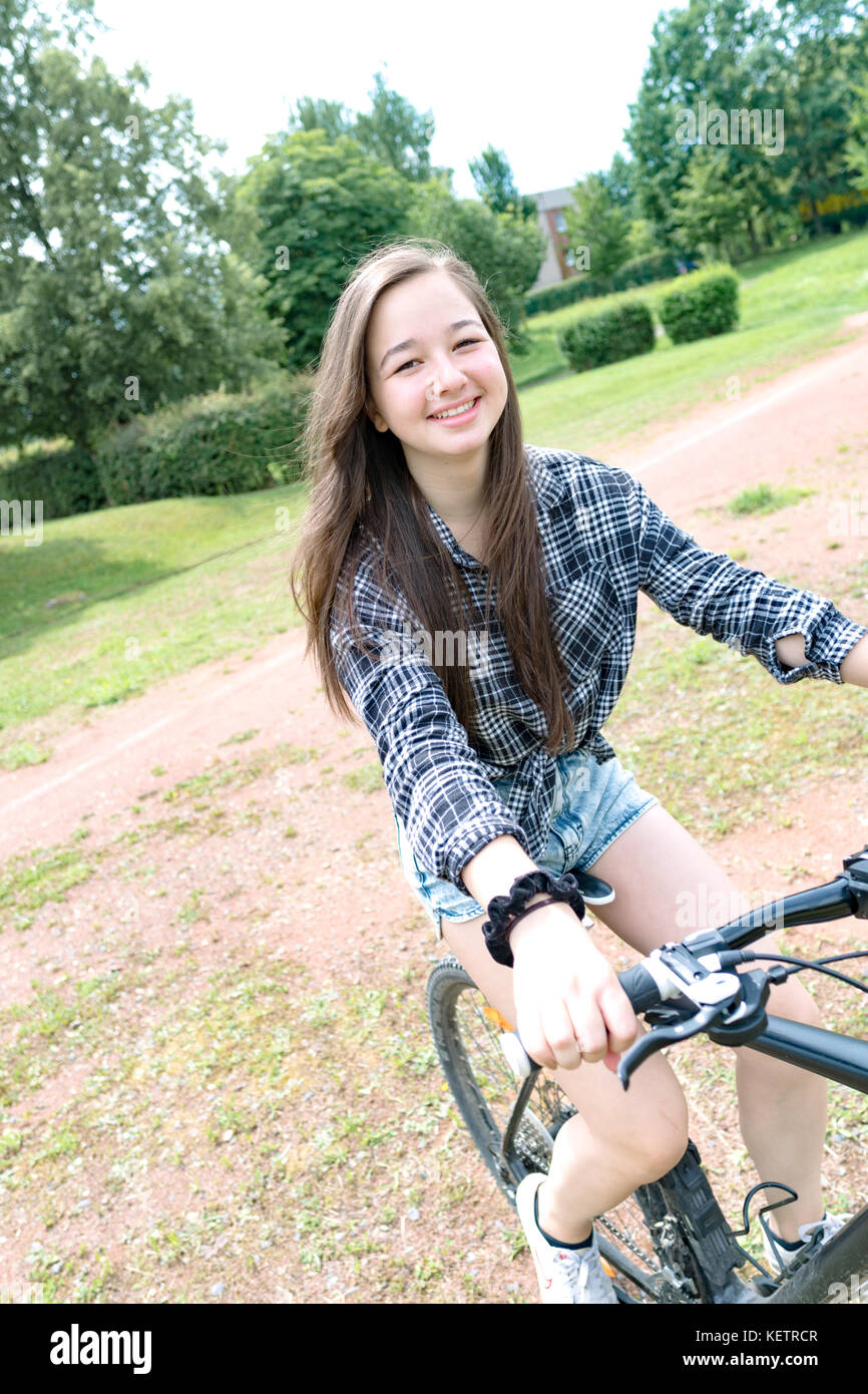 Girl teenager on a bicycle Stock Photo