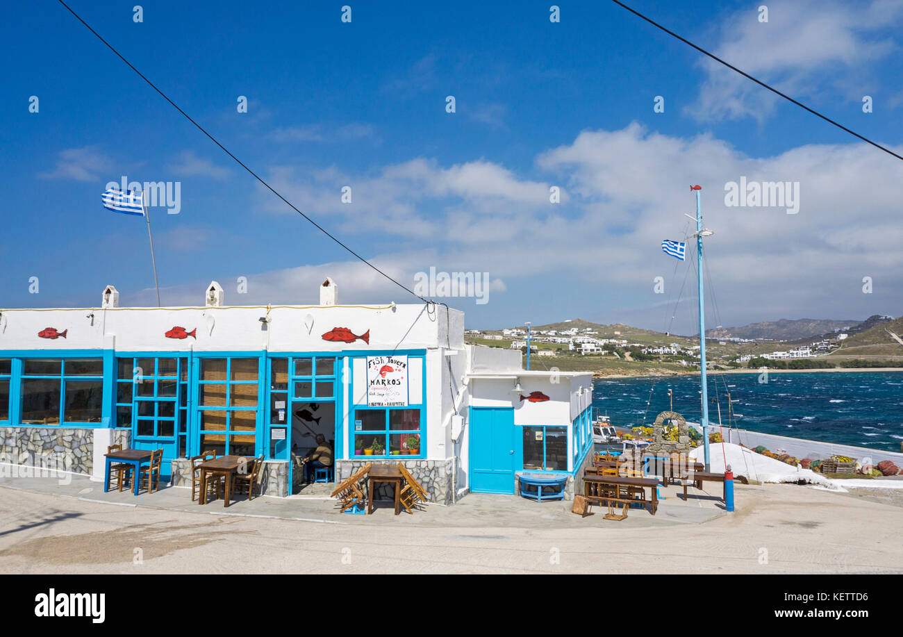 Fish restaurant Markos at tiny fishing harbour, Agia Anna bay, Mykonos, Greece Stock Photo