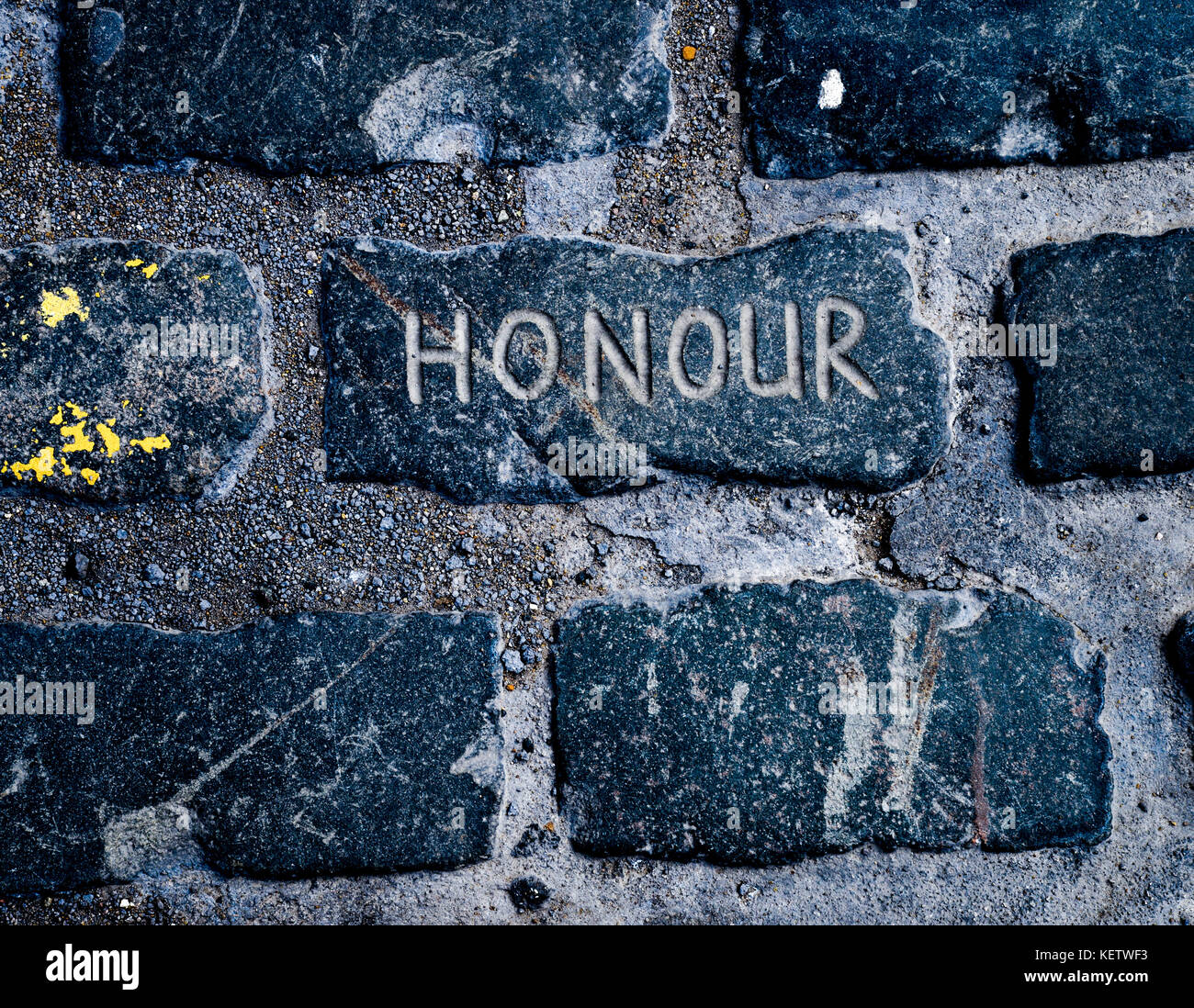 Honour in stone, carved into the cobbles of the Scottish Border town of Kelso Stock Photo