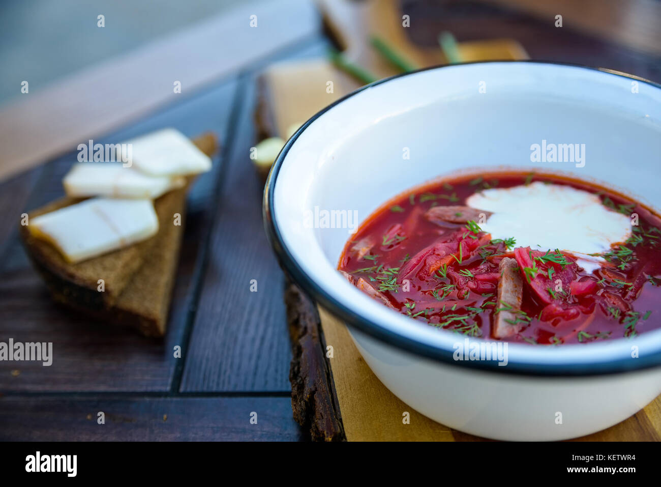 Ukrainian borscht soup and green onion on the table Stock Photo