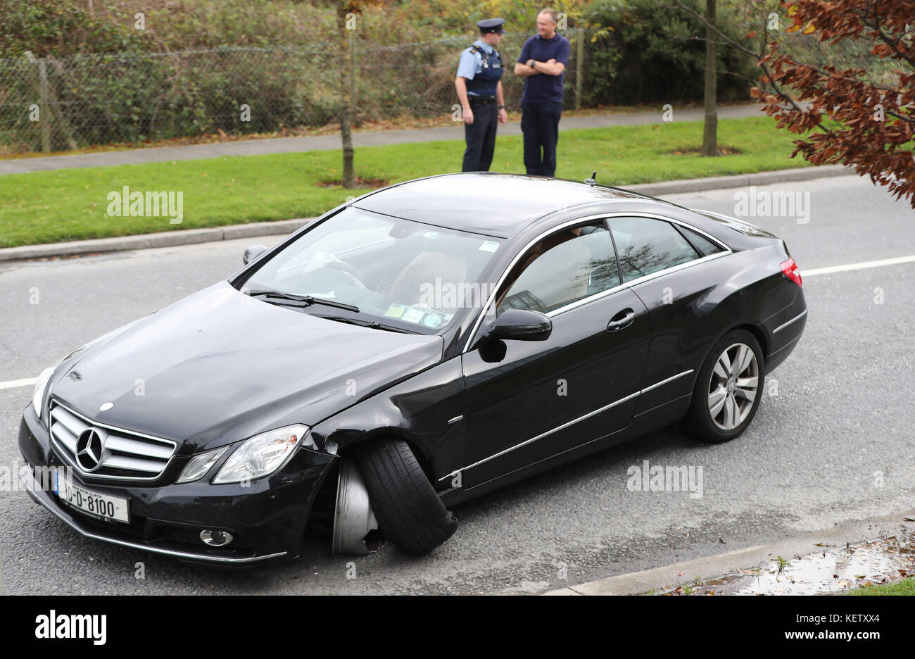 Garda inspect a black Mercedes which was rammed by garda cars in Dublin ...