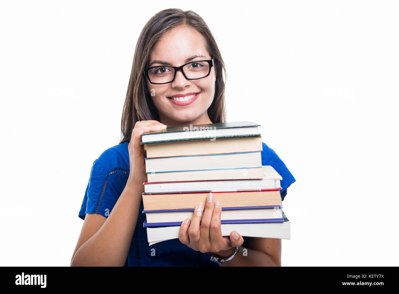 Portrait of beautiful student girl holding books and smiling isolated ...
