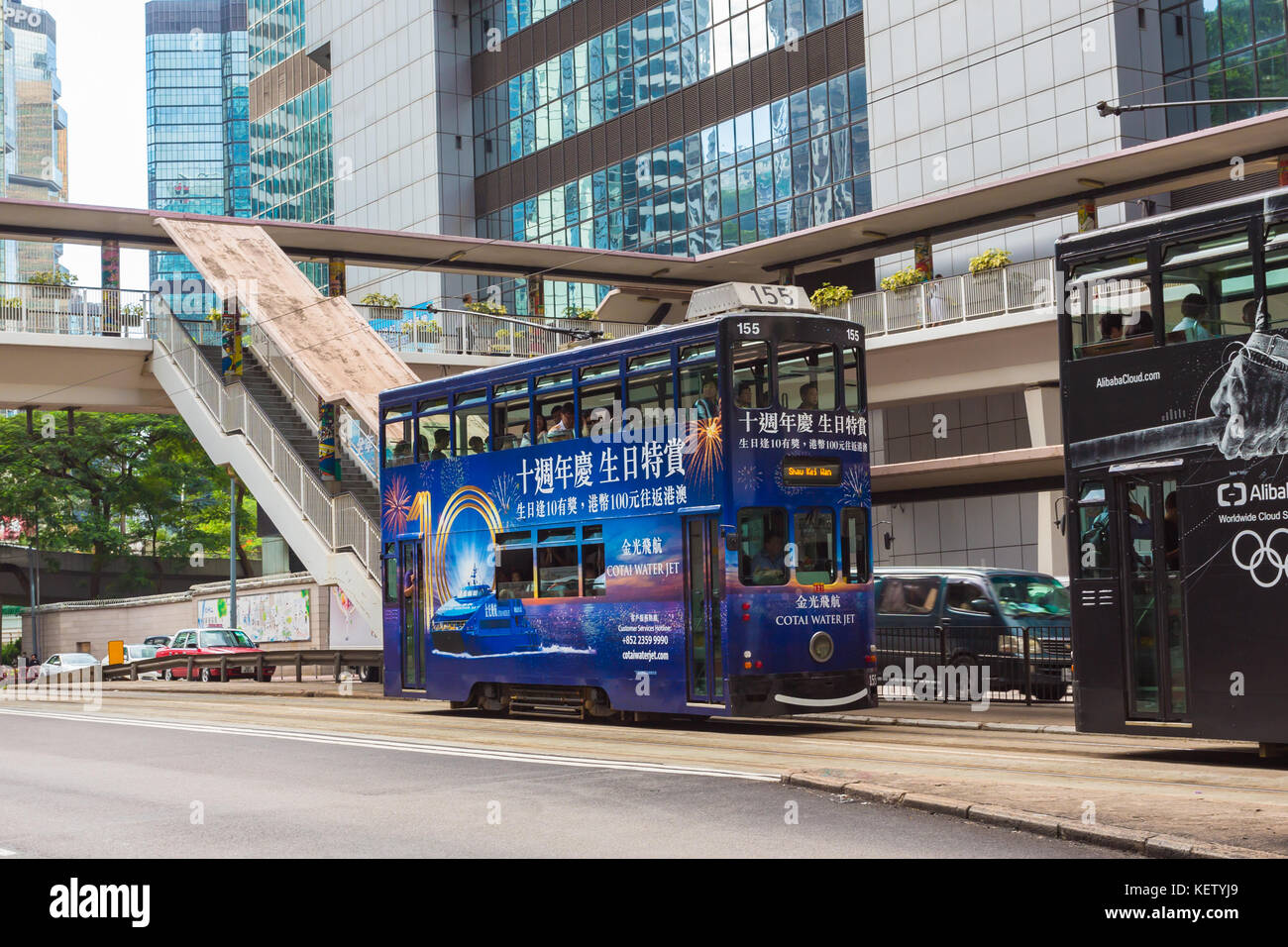 Double-decker tram on street of HK. Hong Kong Tramways is a tram system in Hong Kong, being one of the earliest forms of public transport in the metro Stock Photo