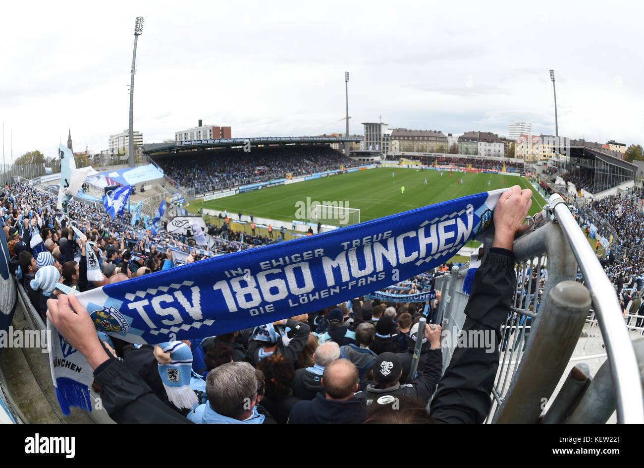 Munich, Germany. 22nd Oct, 2017. A fan of TSV 1860 Munich holds up a scarf  during the regional league soccer match between TSV 1860 Munich and Bayern  Munich II at the Gruenwalder