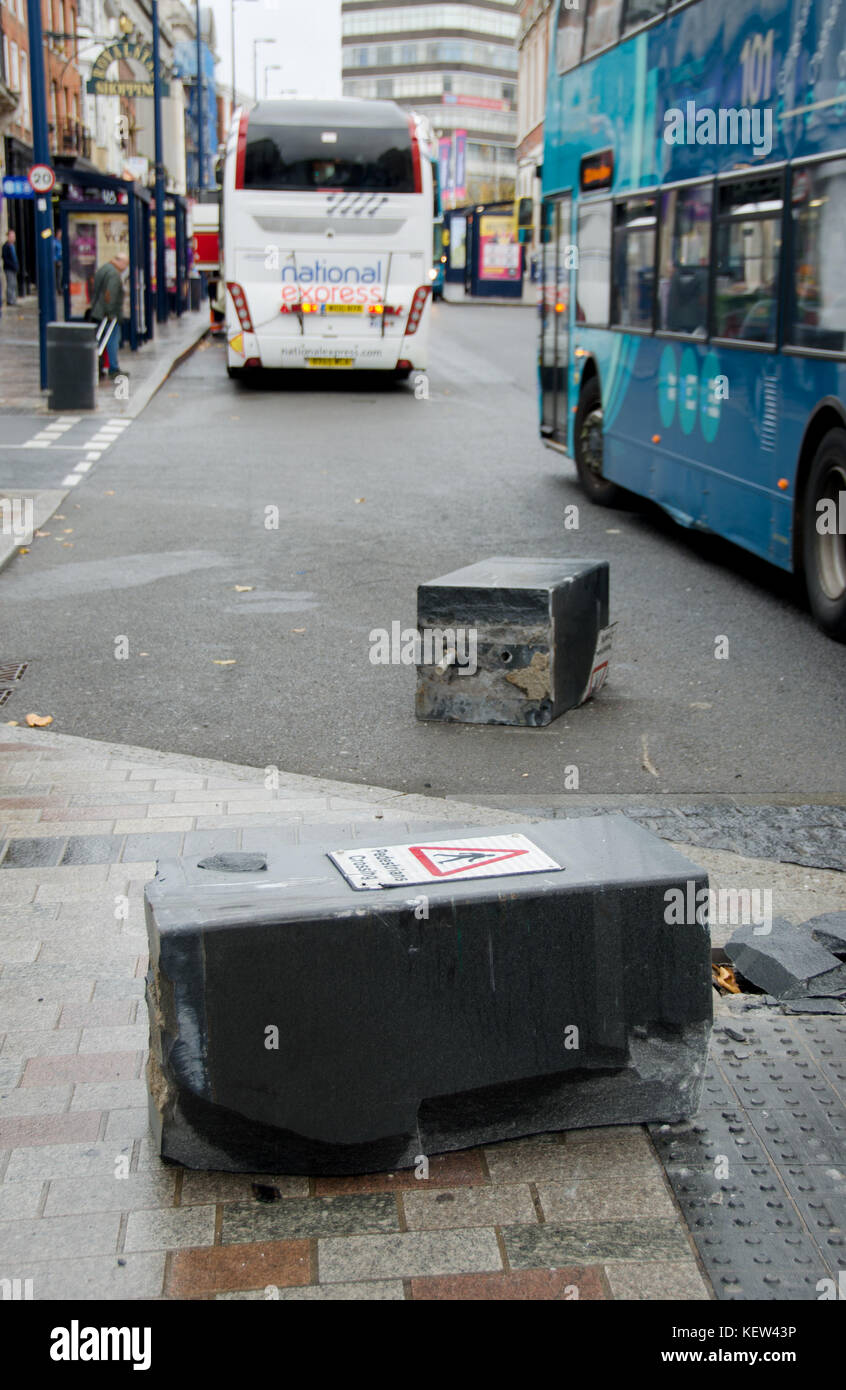 Maidstone, Kent. 23rd Oct, 2017. A coach driver on the Victoria Station to Dover route only made it as far as the traffic bollards in central Maidstone - on his first day in the job. Two bollards used to reduce the High Street to a single lane were knocked over in the collision shortly after 1pm. The National Express coach was still waiting to be towed away nearly three hours later. Nobody was injured and passengers were transferred to taxis to continue their journey Credit: PjrFoto/Alamy Live News Stock Photo