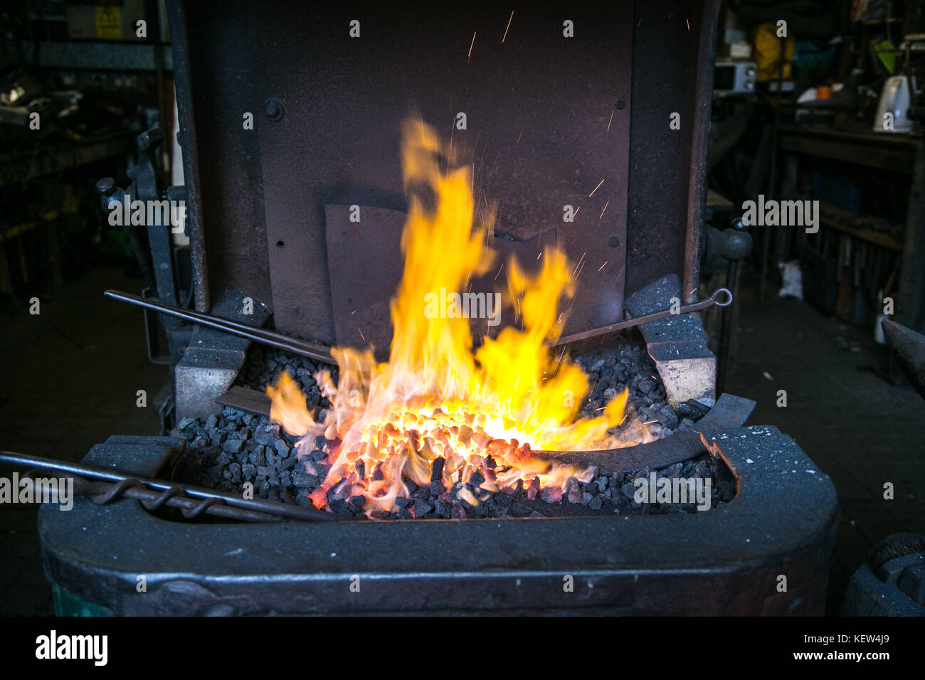 February 10, 2015 - London, United Kingdom - An example of blacksmith furnace fireplace...A blacksmith is someone who creates artificial objects from raw iron or steel by forging them to make new creative products such as furniture, agricultural implements, gates, grilles, cooking utensils, railings, light fixtures, sculpture, tools, decorative and religious items, and weapons. Although, there are some more other carriers that are related such as wheelwrights, armors and furriers. The blacksmith has the general knowledge to create and repair many things which has been made with metal, such as  Stock Photo