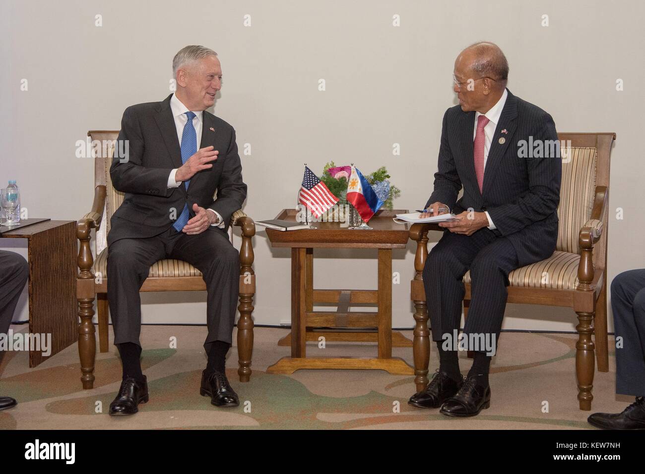 Clark, Philippines. 24th Oct, 2017. U.S. Secretary of Defense Jim Mattis during a bilateral meeting with Philippine Defense Secretary Delfin Lorenzana, right, on the sidelines of the Association of Southeast Asian Nations Defense Ministers meeting October 24, 2017 in Clark, Philippines. Mattis is meeting with many allies and partners to discuss security challenges in the Asian region. Stock Photo