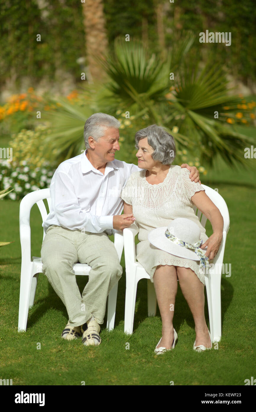 senior couple sitting on chairs Stock Photo - Alamy