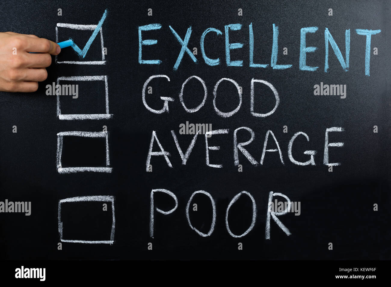 Close-up Of Performance Evaluation Showing Excellent Remark On Blackboard Stock Photo