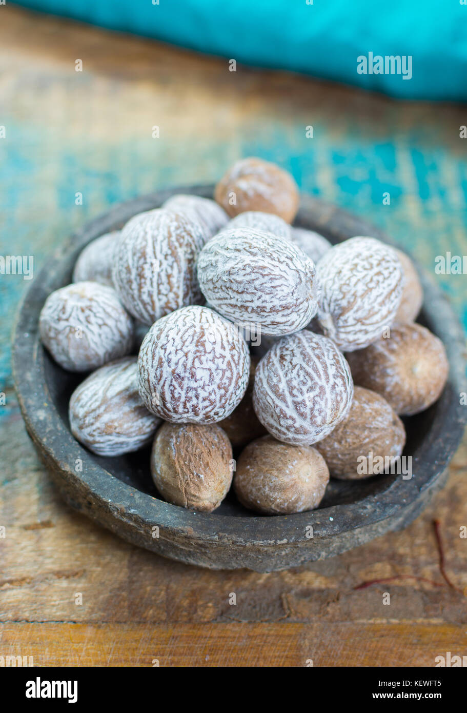 Tasty winter spice whole dried nutmeg, used as an ingredient in many ...