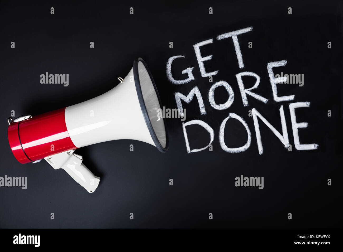 An Announcement For Get More Done Using Megaphone On Blackboard Stock Photo