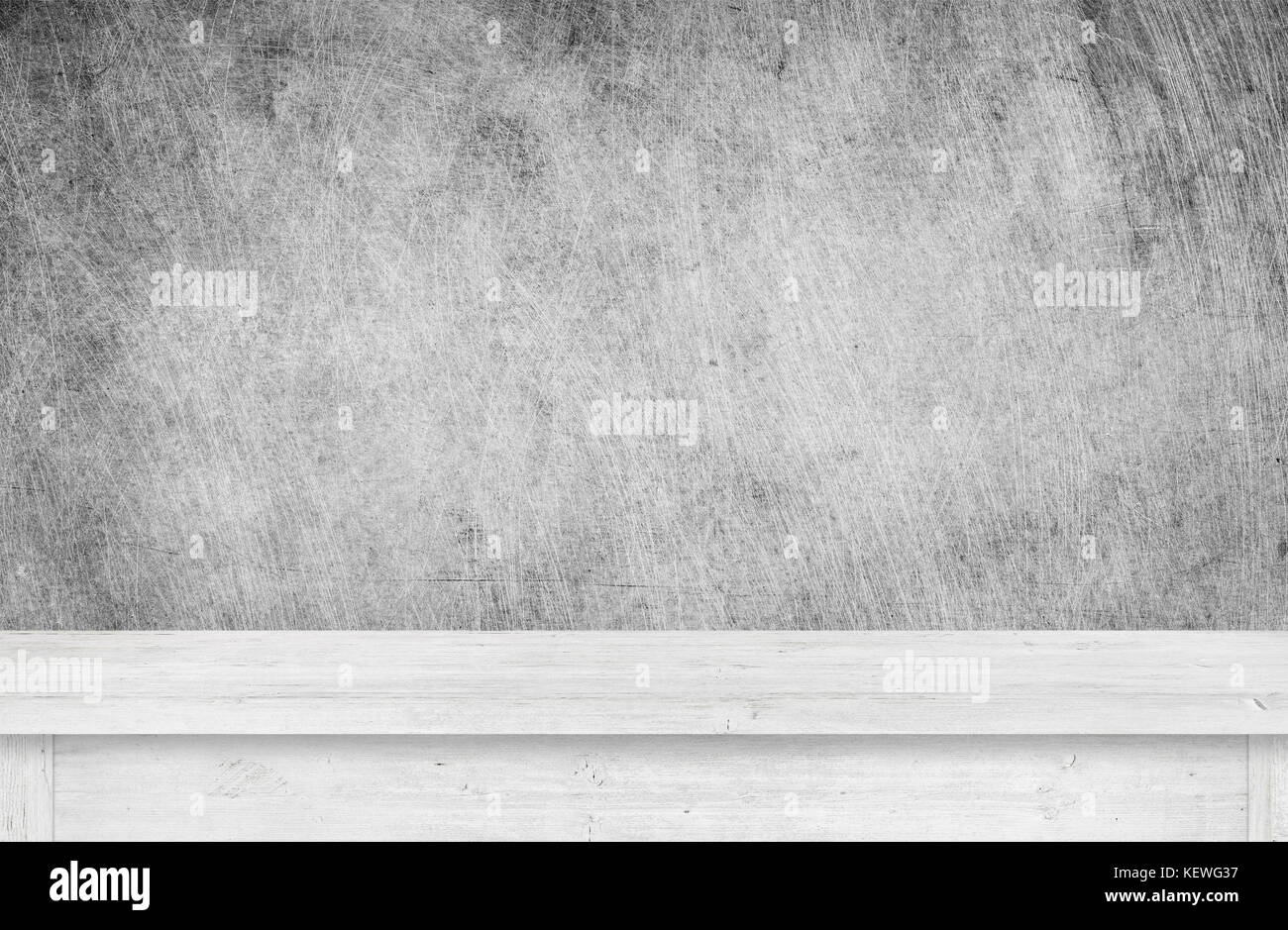White wooden table top near scratched grunge wallpaper Stock Photo Alamy
