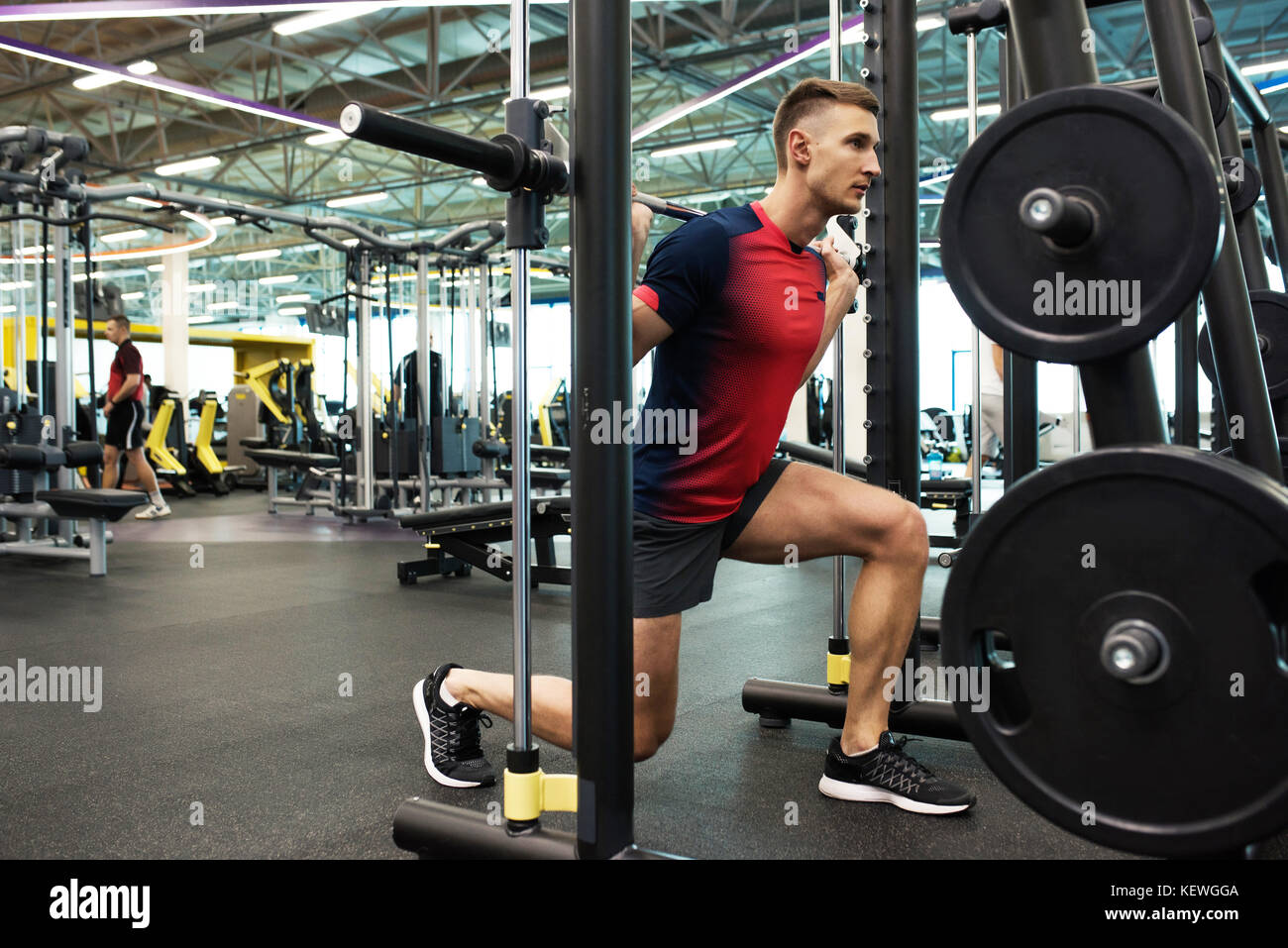 Modern Sportsman Working Out in Gym Stock Photo