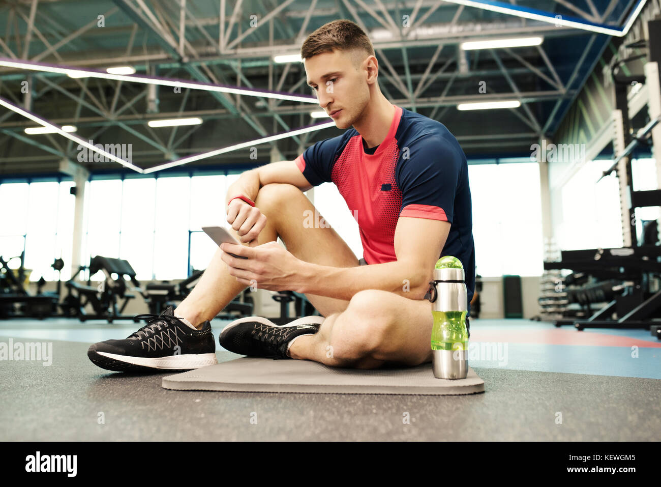 Sportsman taking Break in Gym Stock Photo